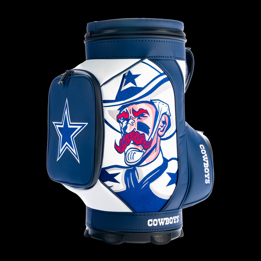 SWAG Golf Dallas Cowboys Den Caddy Cooler featuring bold comic-style Cowboys artwork, navy and white graphics, embroidered team logos, and premium leather construction.