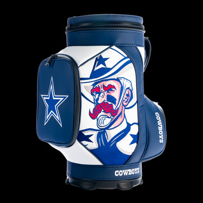 SWAG Golf Dallas Cowboys Den Caddy Cooler featuring bold comic-style Cowboys artwork, navy and white graphics, embroidered team logos, and premium leather construction.