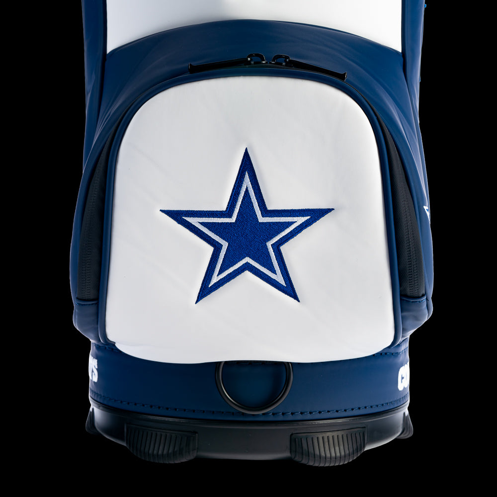 Close-up of the embroidered Dallas Cowboys star on the front storage pocket with textured leather and detailed stitching.