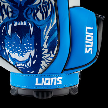 Close-up of the roaring lion artwork featuring bold blue linework, sharp fangs, and swirling graphic details.