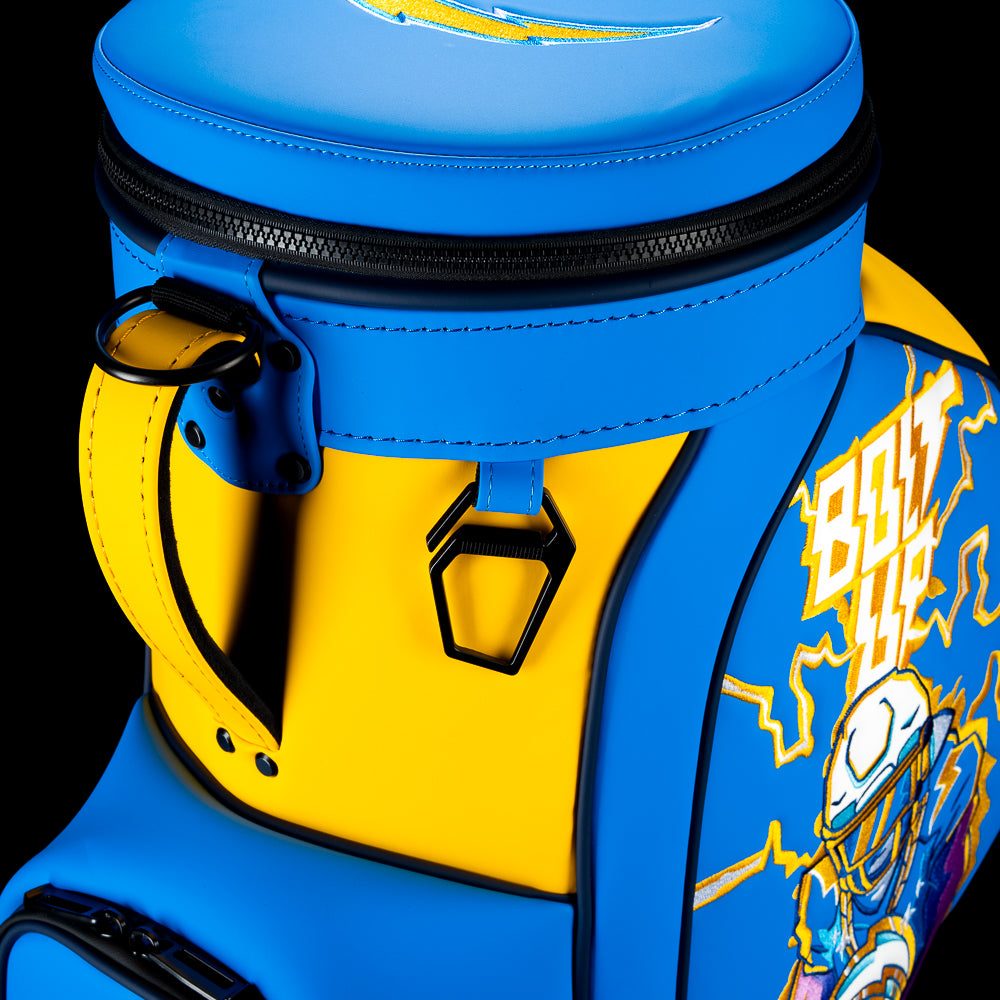 Close-up of the Los Angeles Chargers Den Caddy Cooler zipper, handle, and powder blue and gold panels.