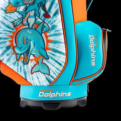 Close-up of the embroidered Dolphins logo on the front pocket with the vintage player artwork in the background.