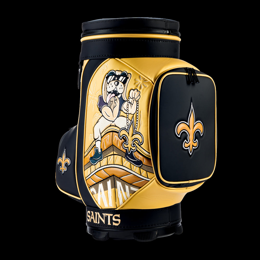 Angled view of the SWAG Golf New Orleans Saints Den Caddy Cooler showcasing the vintage Saints fan artwork and embroidered logo on pocket.