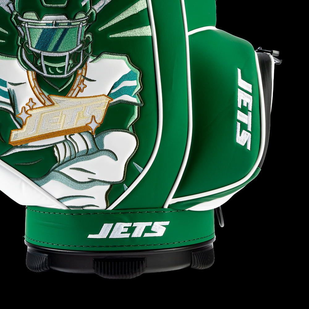 Close-up of the embroidered Jets logo on the front pocket with the football artwork in the background.