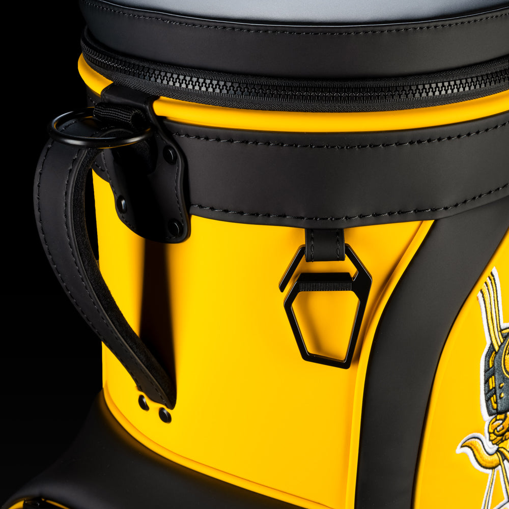 Close-up of the Pittsburgh Steelers Den Caddy Cooler zipper, handle, and black and gold panels.