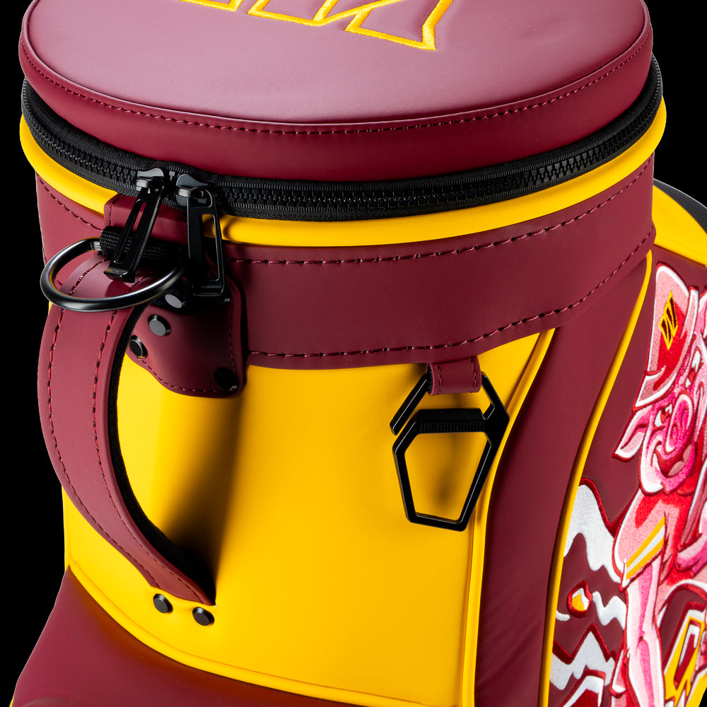 Close-up of the Washington Commanders Den Caddy Cooler zipper, handle, and burgundy and gold panels.