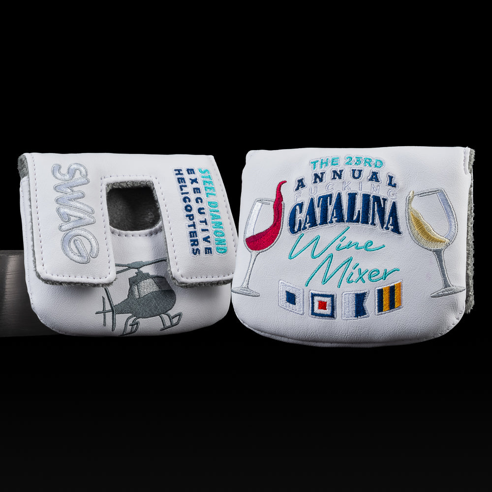 White mallet cover with Catalina Wine Mixer embroidery, wine glasses, and helicopter stitched in bold. 