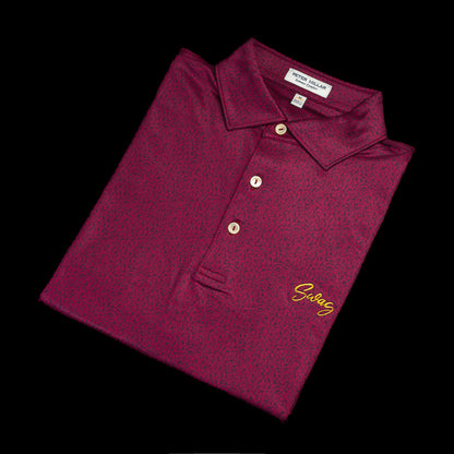 Burgundy Peter Millar men's short sleeve golf polo shirt with yellow SWAG on the left chest and cigar on the left sleeve. 