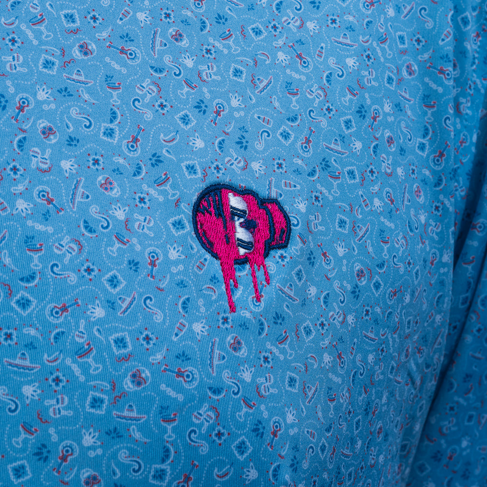 SWAG Golf x Peter Millar summer comfort men's performance golf polo with Day of the Dead print and leaking embroidered skull over the left chest.