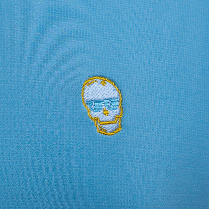 SWAG Golf x Peter Millar sky blue performance hoodie with 8-bit skull and game over embroidery on the left sleeve. 