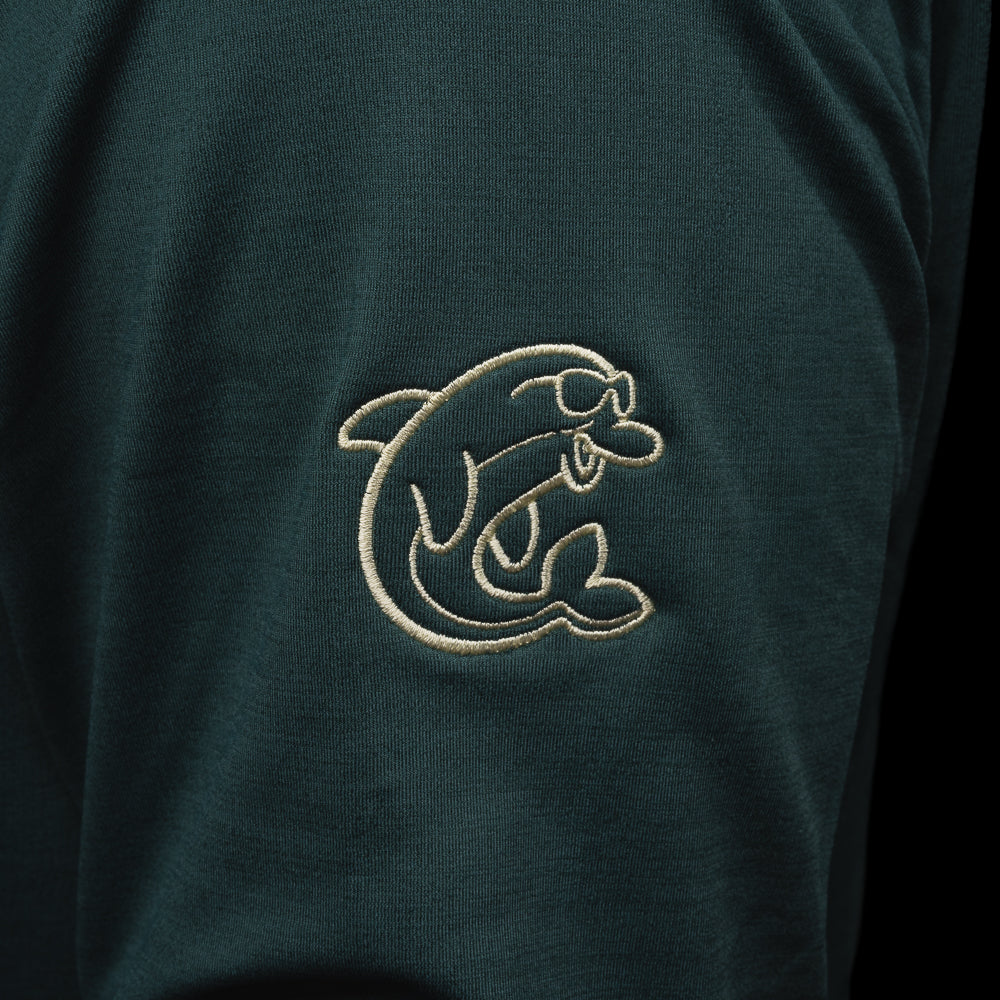 Person wearing a nordic green long sleeve performance golf hoodie with 'Swag' logo.