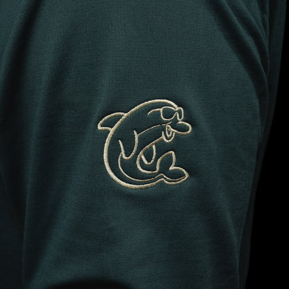 Person wearing a nordic green long sleeve performance golf hoodie with 'Swag' logo.