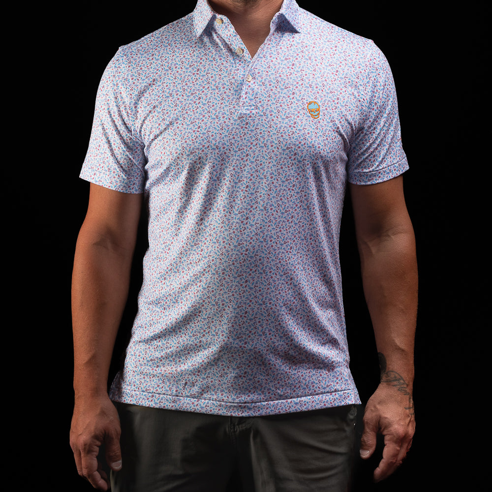 Peter Millar x SWAG Golf orange crush men's short sleeve performance golf polo shirt.