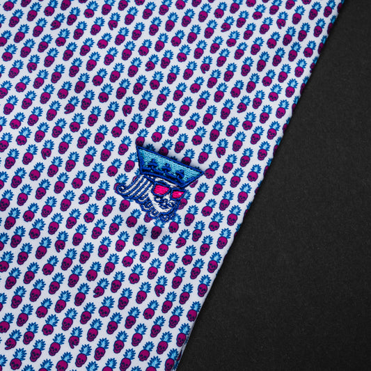 Swag x Peter Millar men's white, blue and pink pineapple skull print short sleeve golf polo shirt with an embroidered king on the left chest.
