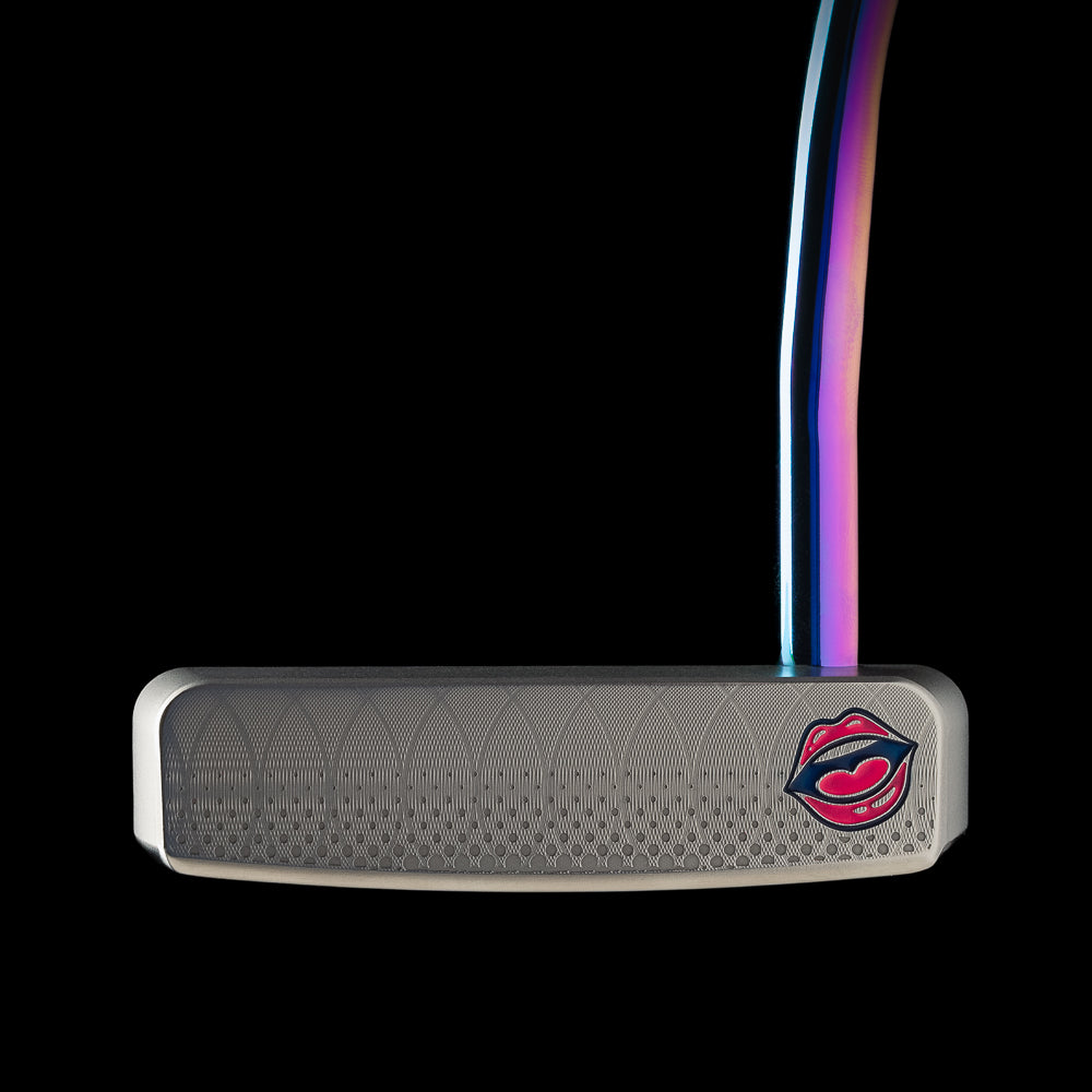 Colorful pop art inspired mid-mallet golf limited edition putter with a design of a woman's face and sunglasses, featuring the text 'Don't Give a Putt!'.