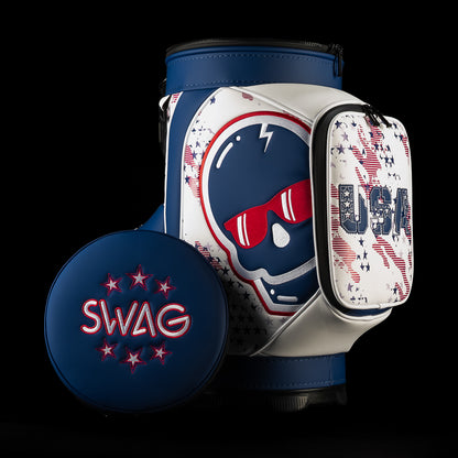 Front three-quarter view of the USA Skull Stars & Stripes Den Caddy Cooler featuring an embroidered navy skull in red sunglasses, patriotic star graphics, USA pocket and navy SWAG lid.