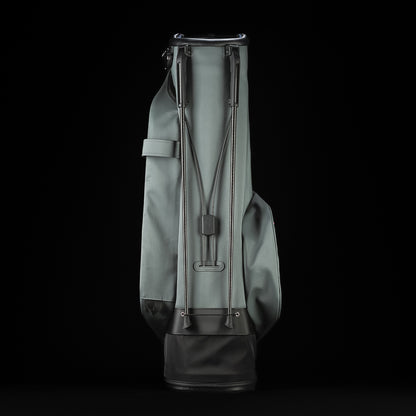 Gray SWAG Golf x Vessel golf stand bag with colorful dollar bill themed designs on a black background.