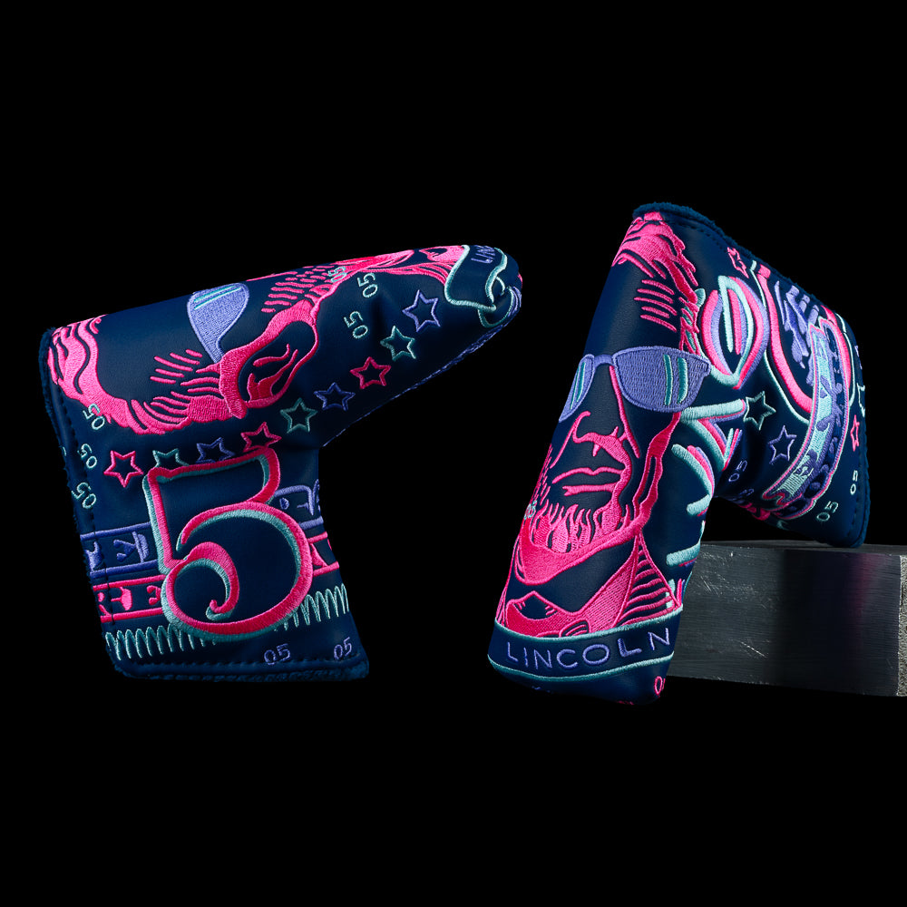 SWAG Golf Gigantic Lincoln blade cover with large Lincoln graphic, money artwork, and neon pink and blue accents.