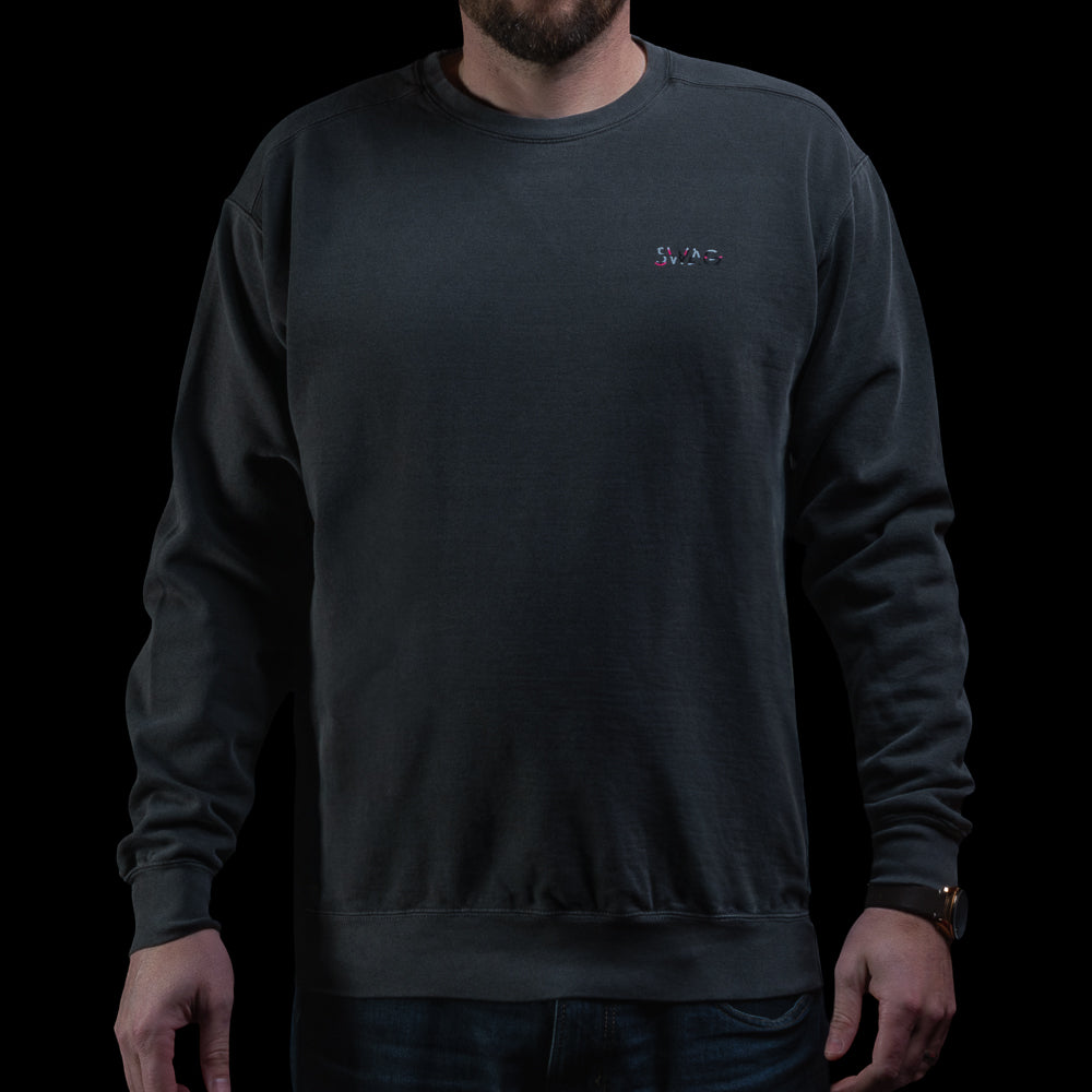 SWAG Golf Glitched Out Benji crewneck sweatshirt featuring small SWAG logo on left chest in pink and gray glitch detail.