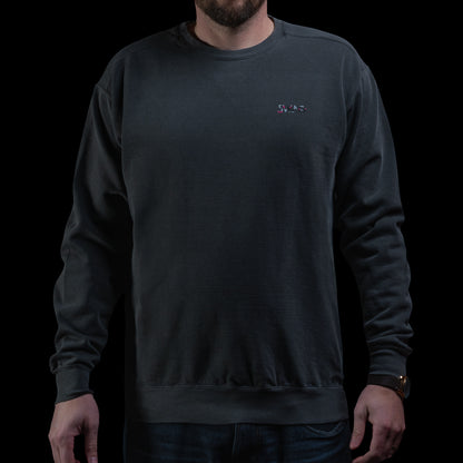 SWAG Golf Glitched Out Benji crewneck sweatshirt featuring small SWAG logo on left chest in pink and gray glitch detail.
