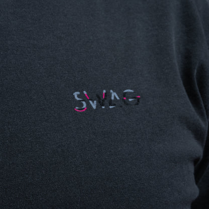 Close-up of embroidered SWAG logo on Glitched Out Benji t-shirt in pink and gray detail with glitch styling.