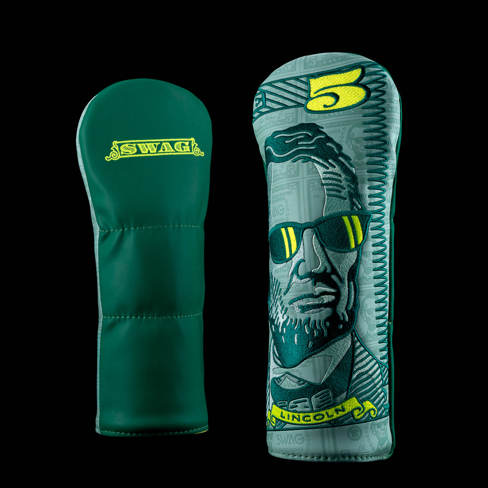 Green Macro Dollar Lincoln fairway cover featuring bold bill artwork, SWAG Golf branding, and Lincoln in shades.