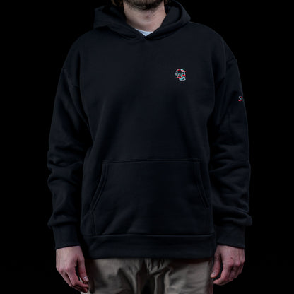 SWAG Golf Glitch Skull Hoodie in black featuring small embroidered glitch skull logo on left chest with front pocket and relaxed fit.