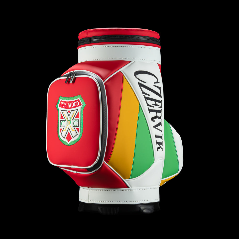 Side view of the Czervik Den Caddy Cooler showing a red Bushwood crest pocket, white trim, Czervik lettering, and yellow and green panels.