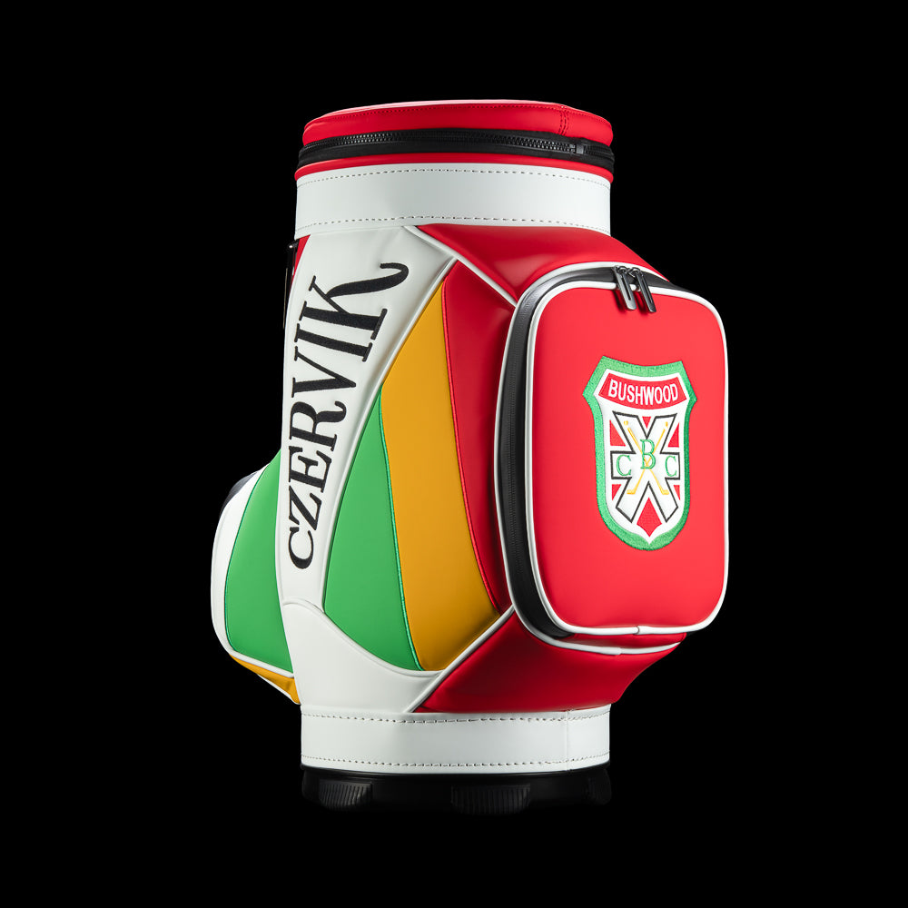 Rewind Golf Caddyshack Czervik Den Caddy Cooler with red, white, green, and yellow panels, vertical Czervik lettering, and a red zippered pocket with a Bushwood crest.
