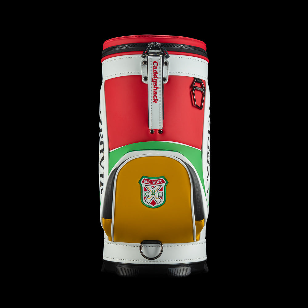 Rear view of the Czervik Den Caddy Cooler showing a white handle, red body, and yellow zippered pocket with a Bushwood crest.