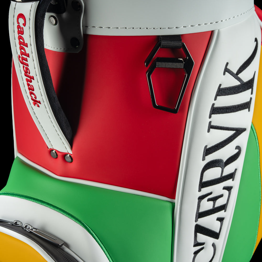 Close-up of the cooler’s white handle with red Caddyshack lettering, black attachment hardware, and vertical Czervik lettering on the side panel.