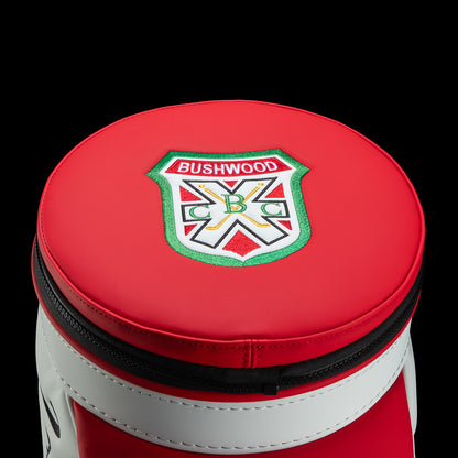 Close-up of the cooler’s red circular lid featuring a Bushwood crest and black zipper.