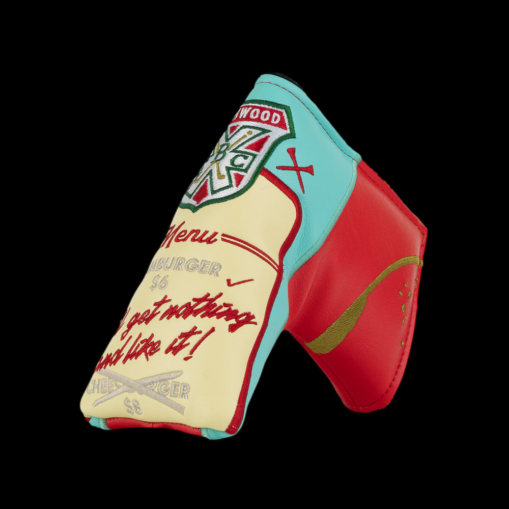 Angled view of Rewind Golf Caddyshack Halfway House Menu blade headcover showing embroidered menu and red backing.