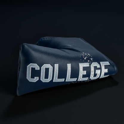 Rewind Golf x Animal House College blue blade golf headcover with 'COLLEGE' text on a black background