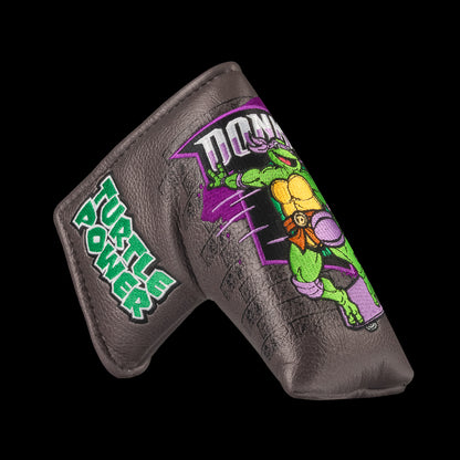 TMNT Donnie blade putter cover featuring bold purple and brick details. A classic Teenage Mutant Ninja Turtles Turtle Power style.