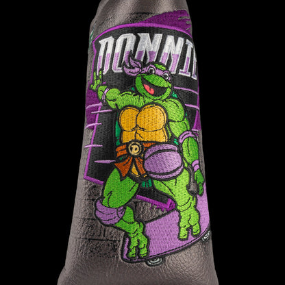 TMNT Donnie blade putter cover featuring bold purple and brick details. A classic Teenage Mutant Ninja Turtles Turtle Power style.