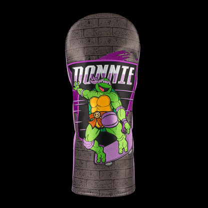 TMNT Donnie driver cover featuring bold purple and brick details. A classic Teenage Mutant Ninja Turtles Turtle Power style.