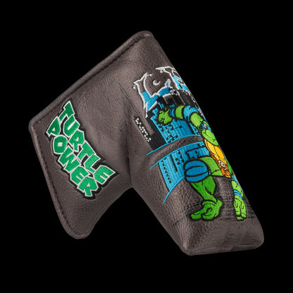 TMNT Leo blade putter cover with swords and blue cityscape detailing.
