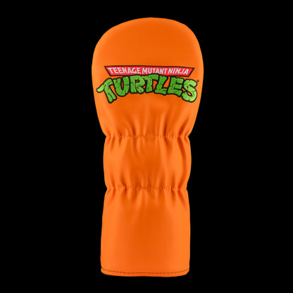 Orange TMNT Mikey driver cover with cartoon design.