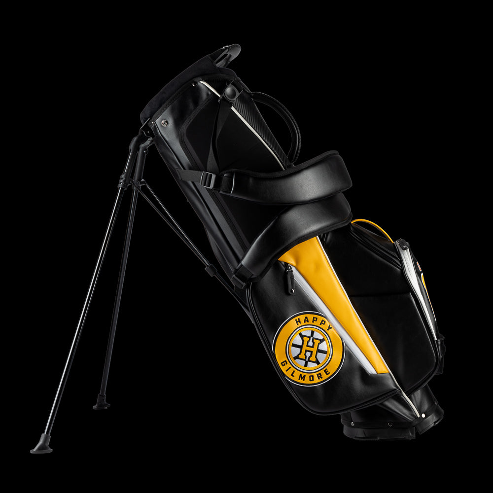 Yellow and black golf bag with 'Gilmore' branding on a white background