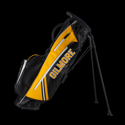 Yellow and black golf bag with 'Gilmore' branding on a white background