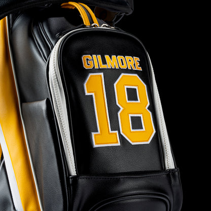 Yellow and black golf bag with 'Gilmore' branding on a white background