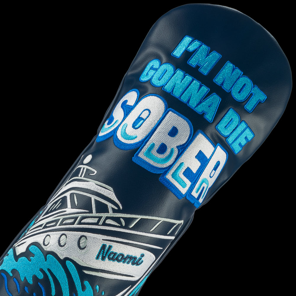 Rewind Golf x Wolf of Wall Street officially licensed navy driver golf headcover with "I'm not gonna die sober" quote and the Naomi yacht crashing through waves.
