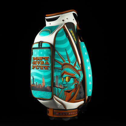 SWAG x Vessel golf bag with Statue of Liberty design and 'Don't Give a Putt' text on a black background