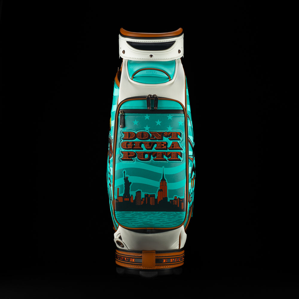 SWAG x Vessel golf bag with Statue of Liberty design and 'Don't Give a Putt' text on a black background