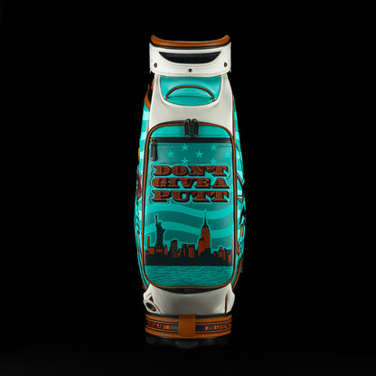 SWAG x Vessel golf bag with Statue of Liberty design and 'Don't Give a Putt' text on a black background
