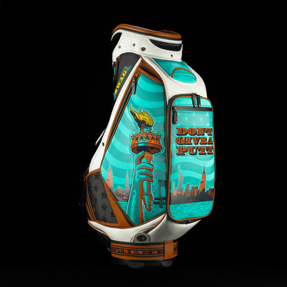 SWAG x Vessel golf bag with Statue of Liberty design and 'Don't Give a Putt' text on a black background