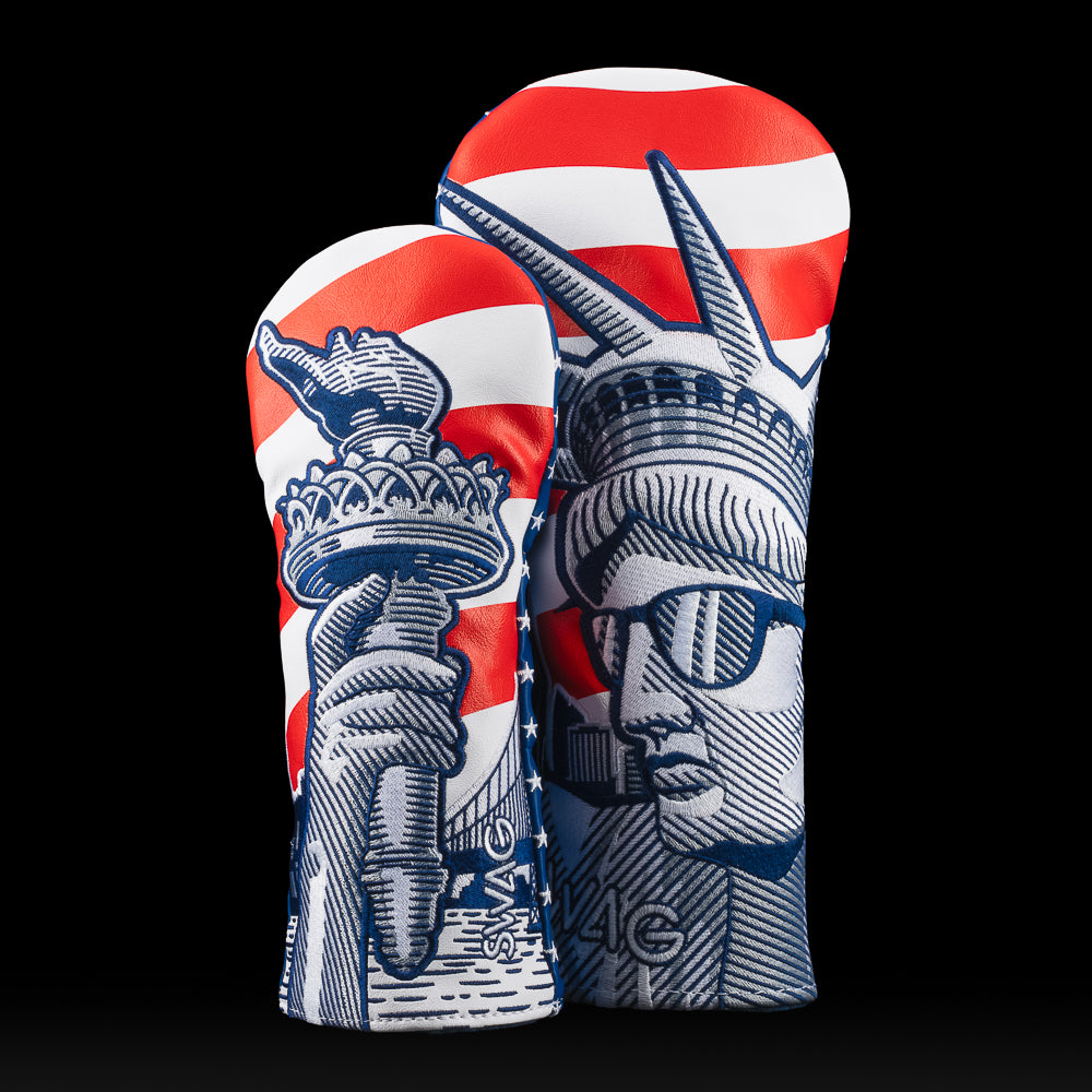 Two golf club head covers with a design of the Statue of Liberty on a black background