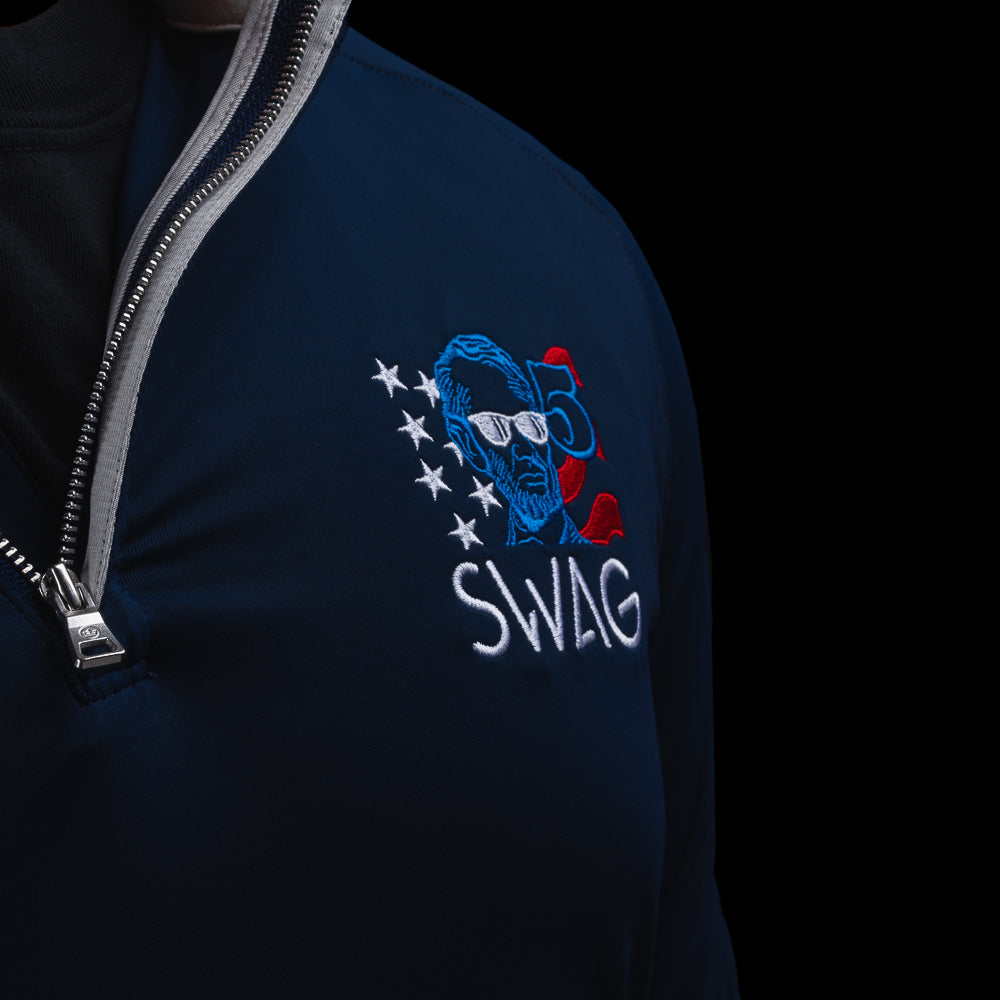 Navy long-sleeve golf performance quarter zip pullover with 'SWAG' logo worn by a person on a black background