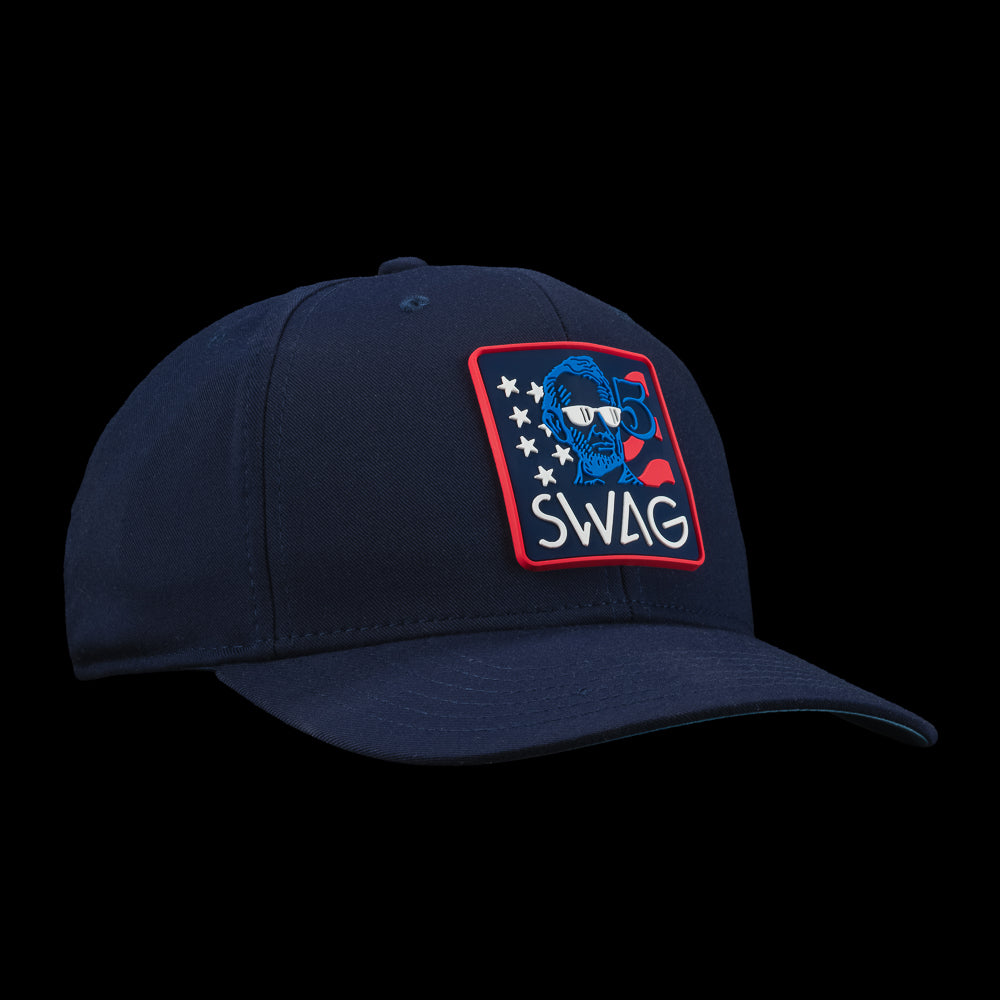 Navy blue cap with a colorful 'SWAG' patch featuring a cartoon character on a black background